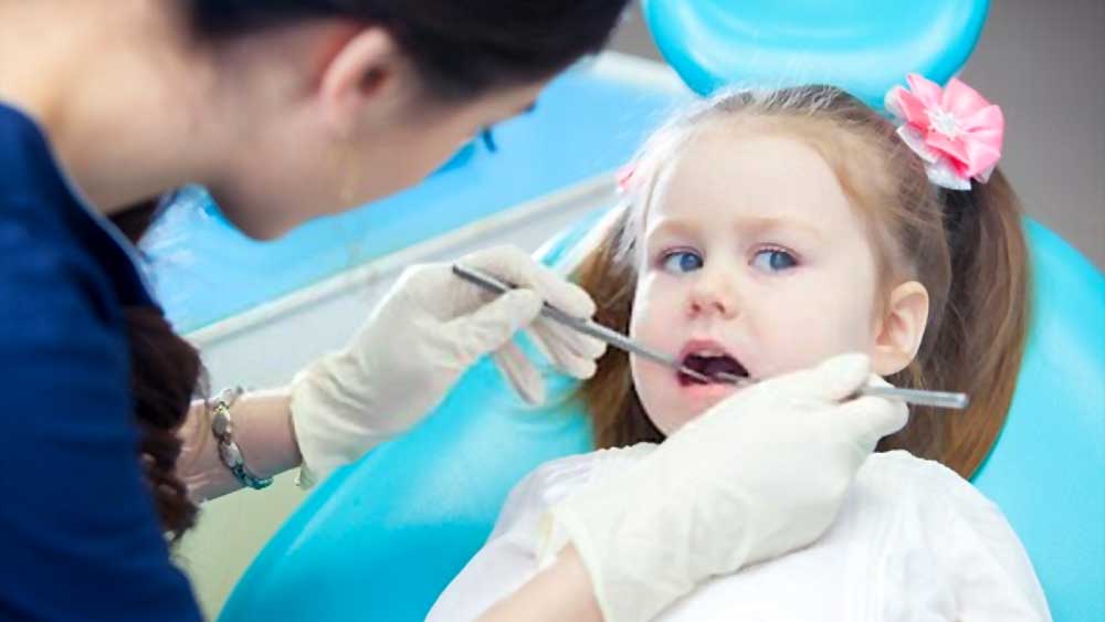 young child getting dental checkup for good oral health